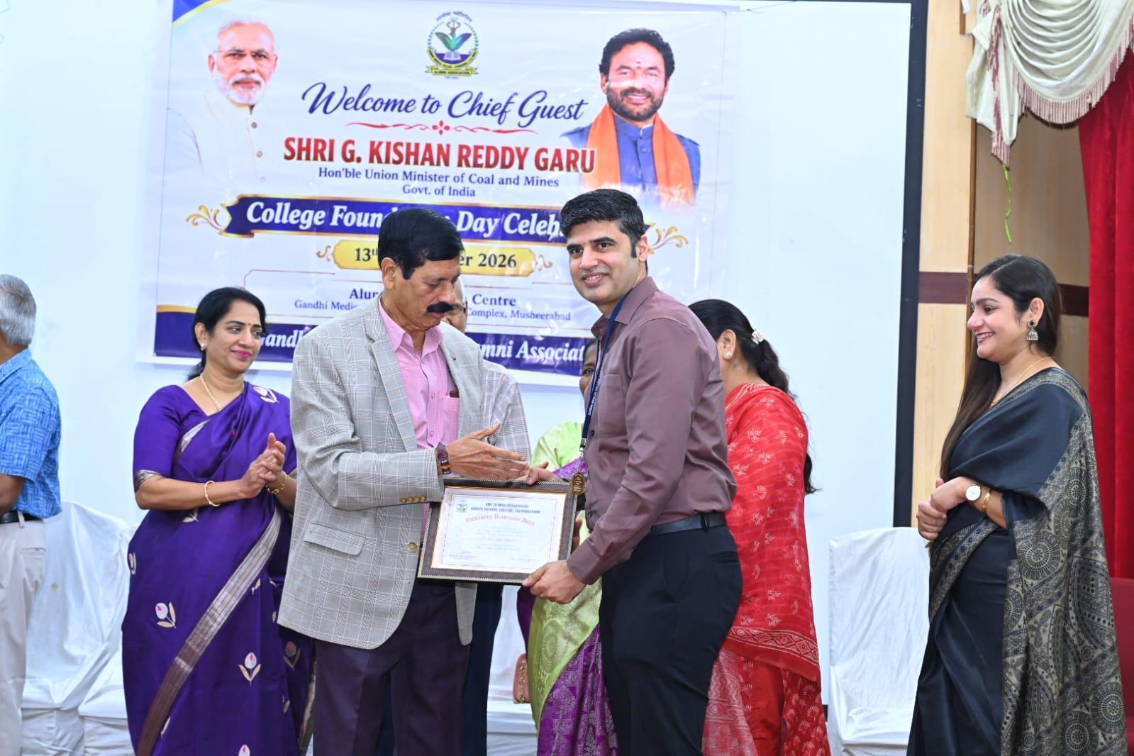 Dr. Manpreet receiving a certificate at an academic recognition event